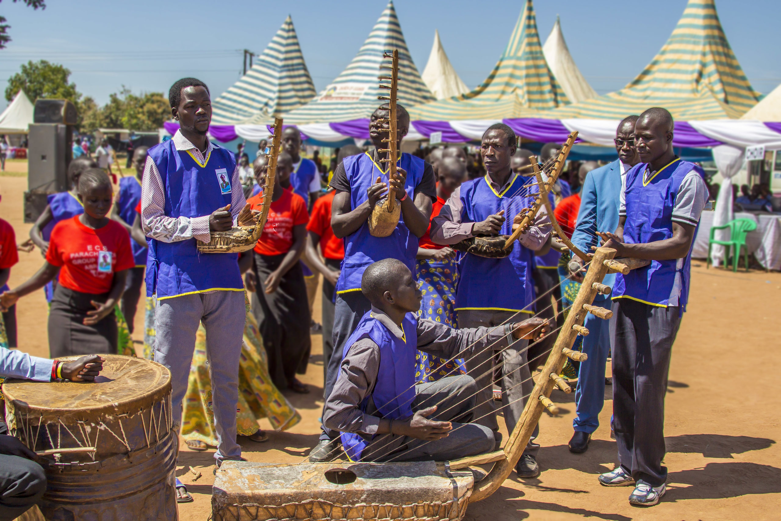 Playing a traditional Keliko harp