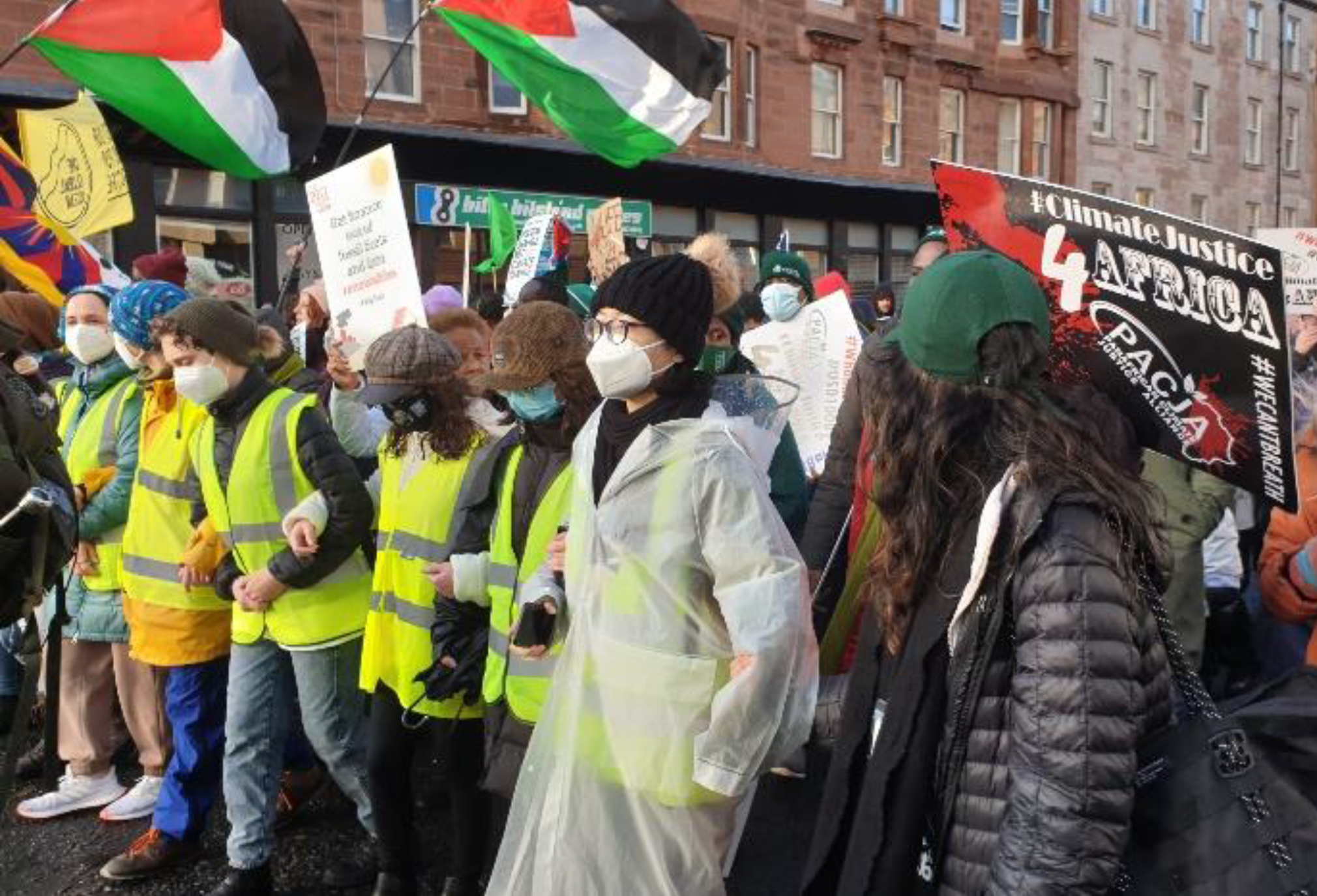 Image of protesters marching at COP26