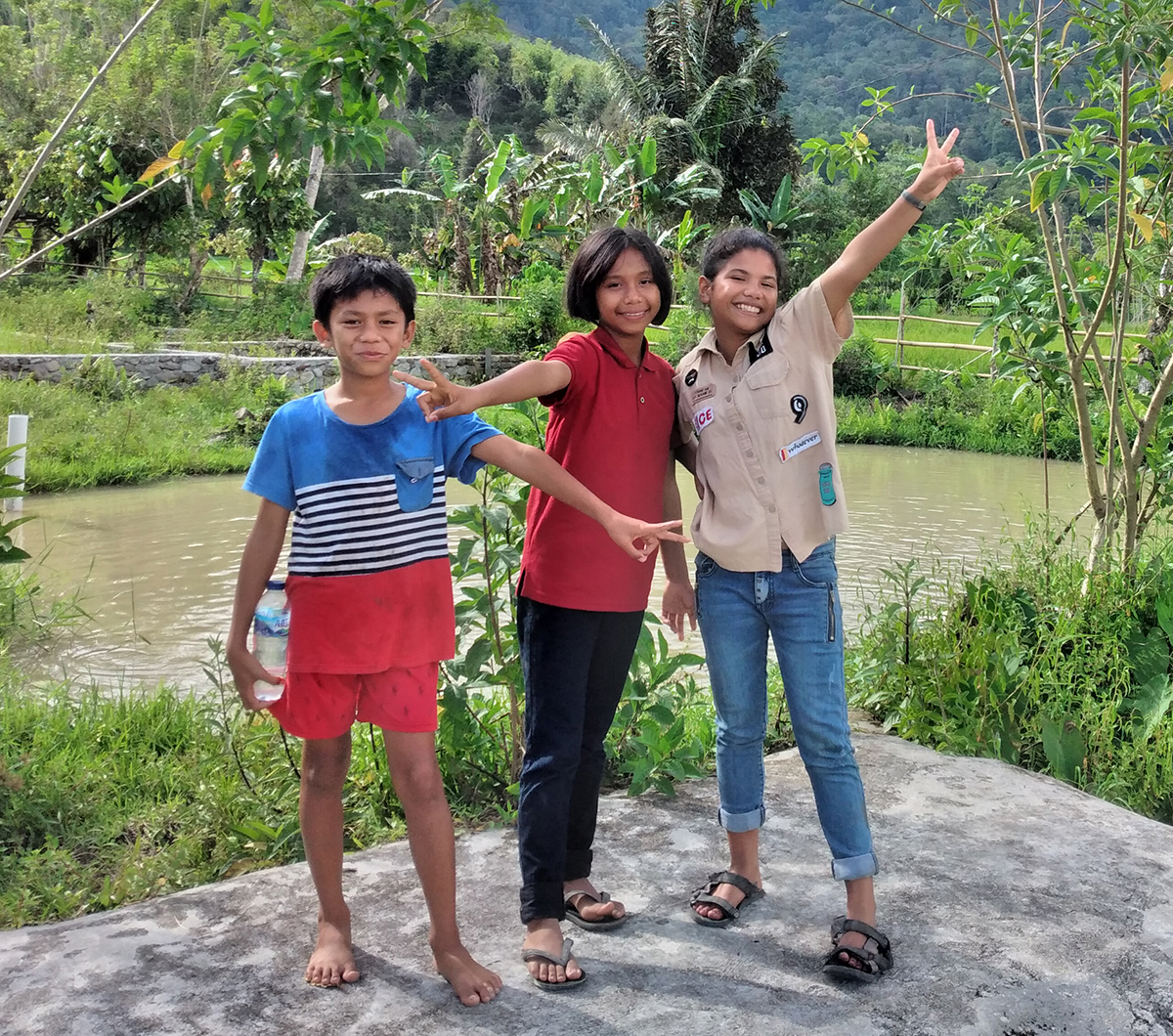 Image of laughing Moma children in Indonesia