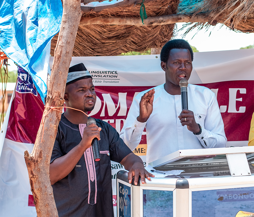 Image of Laminu preaching in Konni at the launch event