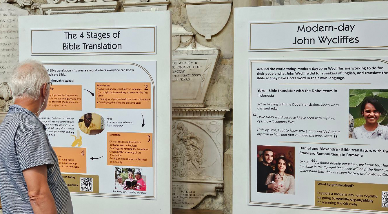 Image of a man looking at the ‘Bible for all’ exhibition in Bath Abbey