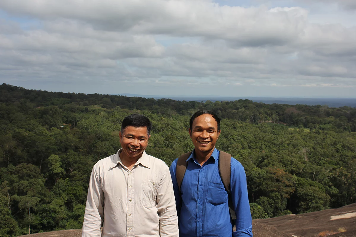 Image of Bunong Bible translators Lonh and Borat near the Vietnam border